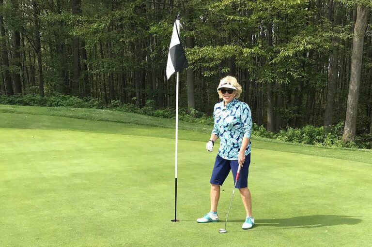 Lori Boettler|x Female golfer in green|Lori Boettler Award Image